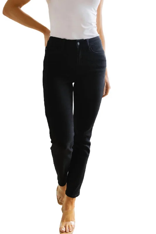 Iconic women’s outfits that never go out of style   Mid Rise Classic Slim Jeans In Black